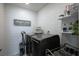 Well-organized laundry room with modern appliances and rustic decor at 3531 Montepulciano Ln, Henderson, NV 89044