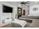 Spacious living room with large sectional sofa and contemporary design at 3531 Montepulciano Ln, Henderson, NV 89044
