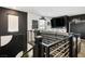 Comfortable loft space with home theater, a large screen, and stylish black and white decor at 3531 Montepulciano Ln, Henderson, NV 89044