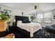 Bright main bedroom featuring a striking headboard, soft bedding, and stylish decor at 3531 Montepulciano Ln, Henderson, NV 89044