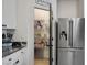 Pantry with shelving, next to a stainless steel fridge in the kitchen at 3531 Montepulciano Ln, Henderson, NV 89044