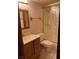 A cozy bathroom featuring a standard shower and oak vanity at 3930 University Center Dr # 612, Las Vegas, NV 89119