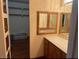 Bathroom vanity featuring wood cabinets and a unique mirrored medicine cabinet with decorative etched glass at 3930 University Center Dr # 612, Las Vegas, NV 89119