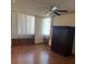 Spacious bedroom featuring hardwood floors, ceiling fan, and natural light at 3930 University Center Dr # 612, Las Vegas, NV 89119