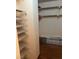 Walk-in closet with white wire shelving and extra flooring at 3930 University Center Dr # 612, Las Vegas, NV 89119