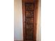 Unique closet door with carved decorative wood panels, creating a focal point in the room at 3930 University Center Dr # 612, Las Vegas, NV 89119