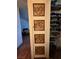 Unique closet door with carved flower wood panels, next to closet with shelving at 3930 University Center Dr # 612, Las Vegas, NV 89119