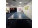 Open game room with ping pong table and comfortable seating area at 3930 University Center Dr # 612, Las Vegas, NV 89119