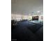 Spacious game room with ping pong table, lounge chairs and dark blue carpet at 3930 University Center Dr # 612, Las Vegas, NV 89119