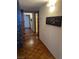 Cozy hallway featuring detailed wood flooring and wall decorations at 3930 University Center Dr # 612, Las Vegas, NV 89119