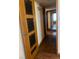 Inviting hallway features detailed wood flooring and panel door to room at 3930 University Center Dr # 612, Las Vegas, NV 89119