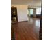 Open-concept living room with hardwood flooring and kitchen access at 3930 University Center Dr # 612, Las Vegas, NV 89119