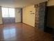 Bright living room featuring hardwood floors and a large window for natural light at 3930 University Center Dr # 612, Las Vegas, NV 89119
