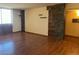 Bright living room featuring hardwood floors and a large window for natural light at 3930 University Center Dr # 612, Las Vegas, NV 89119