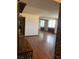 Open-concept living room with hardwood flooring and kitchen access at 3930 University Center Dr # 612, Las Vegas, NV 89119