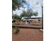 Outdoor picnic area with picnic tables, trees and community grills at 3930 University Center Dr # 612, Las Vegas, NV 89119