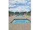 Community pool and spa area features a fenced enclosure, comfortable seating, and clear skies above at 3930 University Center Dr # 612, Las Vegas, NV 89119