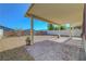 Paver patio under a spacious covered porch in a xeriscaped backyard at 405 Prairie Moon Ave, North Las Vegas, NV 89084