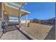 Fenced backyard with rocks, patio, and pergola at 405 Prairie Moon Ave, North Las Vegas, NV 89084