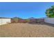 Spacious xeriscaped backyard with decorative plantings and concrete block fencing at 405 Prairie Moon Ave, North Las Vegas, NV 89084