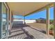 Fenced backyard with rocks, patio, and pergola at 405 Prairie Moon Ave, North Las Vegas, NV 89084