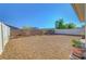 A spacious, xeriscaped backyard with planter boxes and block and white fencing at 405 Prairie Moon Ave, North Las Vegas, NV 89084