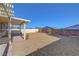 Xeriscaped backyard with patio and privacy fence, perfect for outdoor enjoyment at 405 Prairie Moon Ave, North Las Vegas, NV 89084