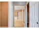 Bathroom view showcases tile flooring, tub, glass shower, and hallway to closet areas at 405 Prairie Moon Ave, North Las Vegas, NV 89084