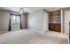 Spacious bedroom featuring a ceiling fan, plush carpet, and a large window for natural light at 405 Prairie Moon Ave, North Las Vegas, NV 89084