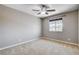 Inviting bedroom featuring soft carpet, neutral walls, and a window for natural light at 405 Prairie Moon Ave, North Las Vegas, NV 89084