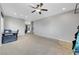 Spacious bonus room features neutral walls, carpet flooring and ceiling fan providing a comfortable open living area at 405 Prairie Moon Ave, North Las Vegas, NV 89084
