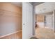 Open closet view, featuring wire shelving with tile flooring transitioning to carpet at 405 Prairie Moon Ave, North Las Vegas, NV 89084