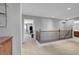 Upstairs hallway with decorative wooden railing at 405 Prairie Moon Ave, North Las Vegas, NV 89084