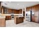 Spacious kitchen with wood cabinets, granite countertops and stainless steel appliances at 405 Prairie Moon Ave, North Las Vegas, NV 89084