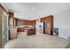 Well-equipped kitchen featuring wood cabinets, stainless steel appliances, and a center island for meal prep at 405 Prairie Moon Ave, North Las Vegas, NV 89084