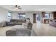 Spacious living area with an open layout, view into the kitchen, and access to the backyard at 405 Prairie Moon Ave, North Las Vegas, NV 89084