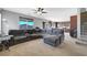 Spacious living room with carpet, and a large sectional sofa at 405 Prairie Moon Ave, North Las Vegas, NV 89084