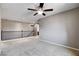 Open loft area featuring neutral walls, plush carpeting, and a dark wooden banister at 405 Prairie Moon Ave, North Las Vegas, NV 89084