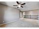 Neutral loft space featuring plush carpeting, ceiling fan, and an open area for flexible use at 405 Prairie Moon Ave, North Las Vegas, NV 89084