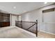 Carpeted loft area with built-in shelving, wooden railing, and ample natural light at 405 Prairie Moon Ave, North Las Vegas, NV 89084