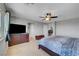 This main bedroom features carpet, a ceiling fan, walk-in closet, and neutral colors at 405 Prairie Moon Ave, North Las Vegas, NV 89084