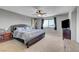 Spacious main bedroom with a ceiling fan, big window, and view of the city at 405 Prairie Moon Ave, North Las Vegas, NV 89084