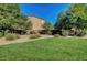 Community park featuring green lawn, desert landscaping, walking trails and mature shade trees at 405 Prairie Moon Ave, North Las Vegas, NV 89084