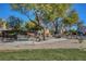 Community park featuring benches, walkways, mature trees, and well-maintained landscaping for outdoor enjoyment at 405 Prairie Moon Ave, North Las Vegas, NV 89084