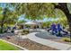 Neighborhood playground with slides, covered seating area, and desert landscaping provides Gathering fun at 405 Prairie Moon Ave, North Las Vegas, NV 89084