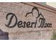 Desert Moon community signage on a brick wall, set against a clear sky at 405 Prairie Moon Ave, North Las Vegas, NV 89084