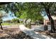Winding community walking path with lush landscaping and shaded seating at 405 Prairie Moon Ave, North Las Vegas, NV 89084