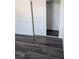 Bedroom featuring a sliding door closet and dark vinyl plank flooring at 4231 E Kellogg Rd, Pahrump, NV 89061