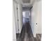 Hallway with gray vinyl flooring featuring two white paneled doors at 4231 E Kellogg Rd, Pahrump, NV 89061