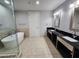 Elegant bathroom featuring a soaking tub, dual sinks, and modern fixtures at 4525 Dean Martin Dr # 1507, Las Vegas, NV 89103